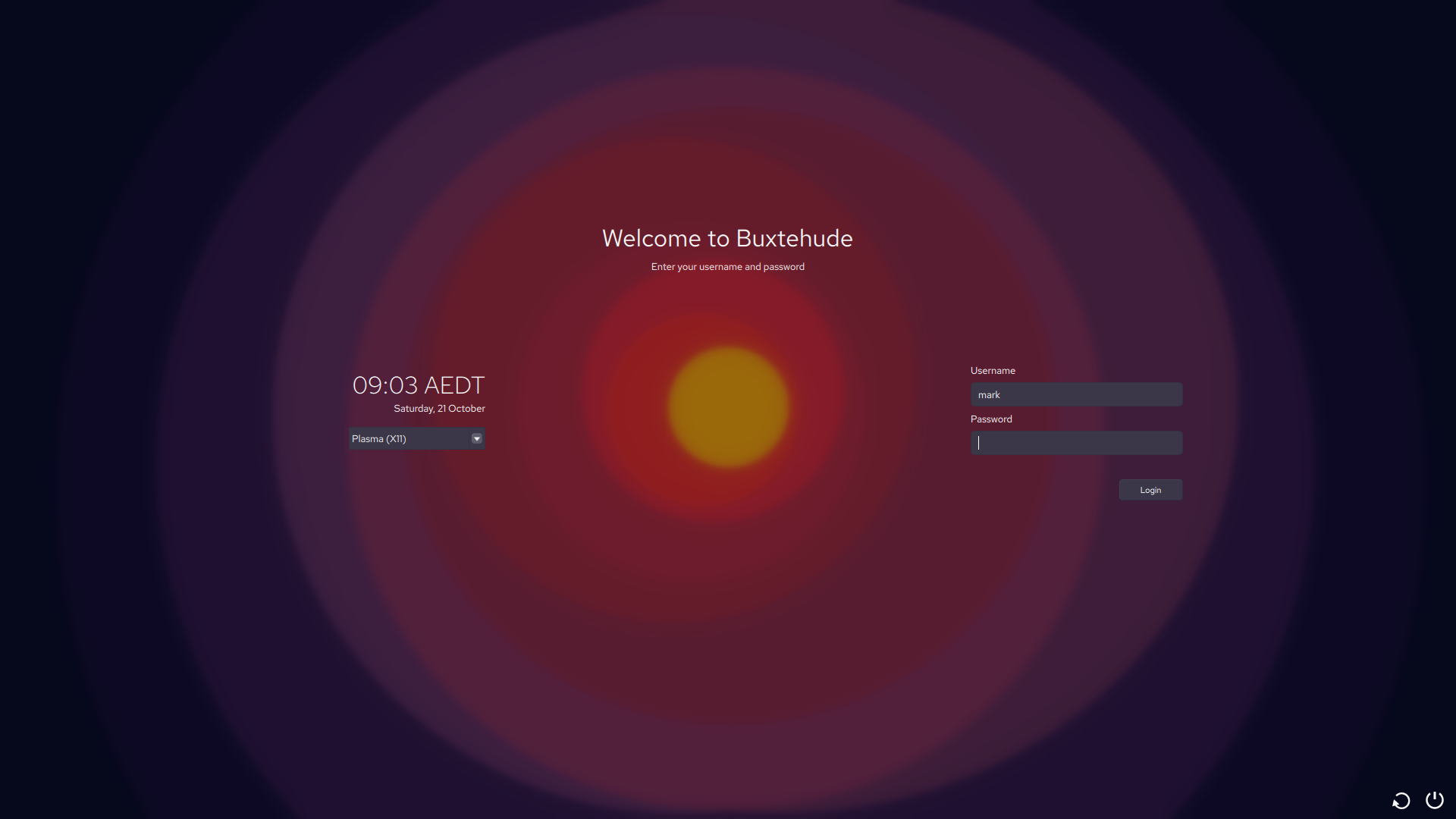 Nostrum-themed login screen

Centered title text:
Welcome to Buxtehude
[subtitle]: Enter your username and password

On the left:
09:03 AEDT
[subtitle]: Saturday, 21 October
Dropdown session menu showing Plasma (X11)

On the right:
Username text field with "mark" text in it
Empty password field
Login button